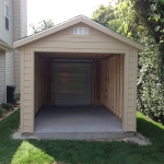 Oerhead garage door on the front of the shed.